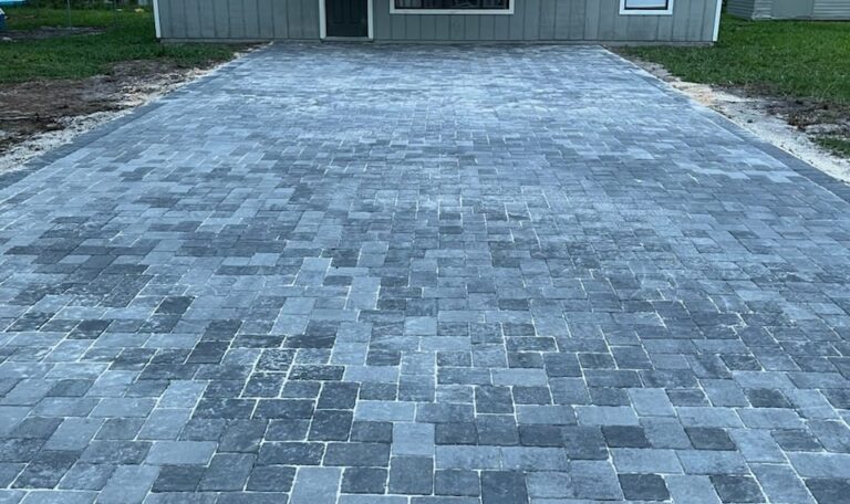 Pavers installation completed for a house's driveway.