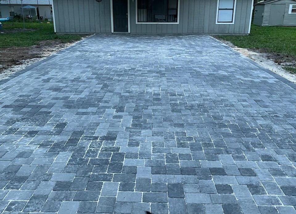 Pavers installation completed for a house's driveway.