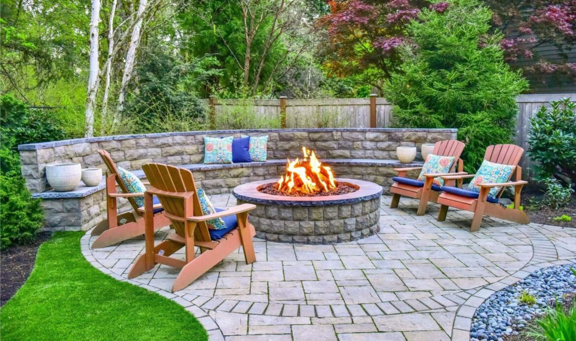 Fire pit made of pavers and chairs around it