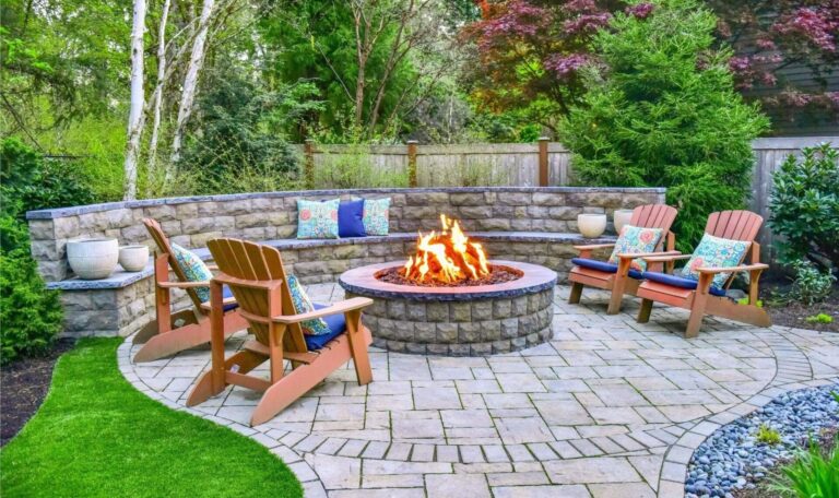 Fire pit made of pavers and chairs around it
